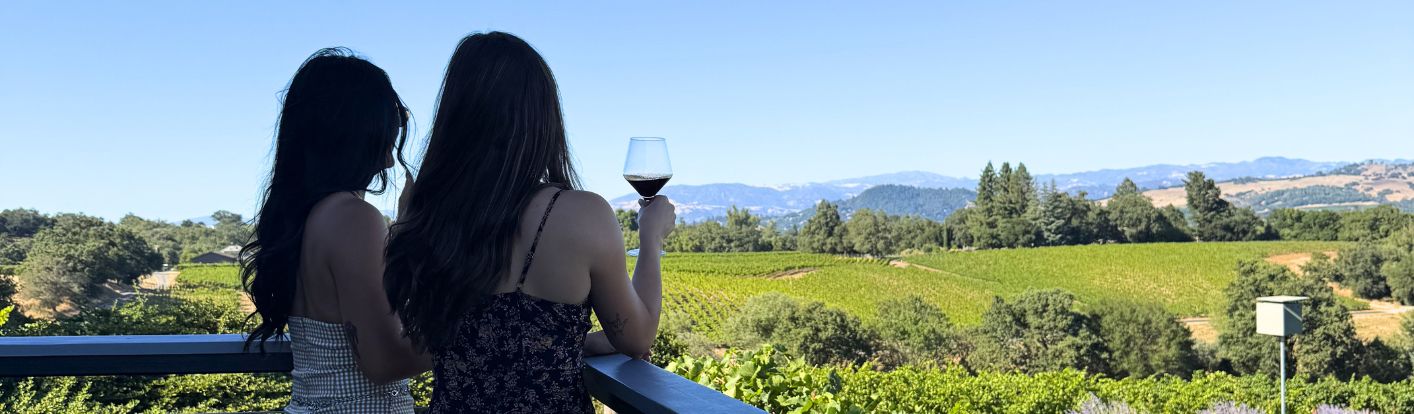 Two guests overlooking a scenic Sonoma vineyard, used for destination-focused hotel marketing content.